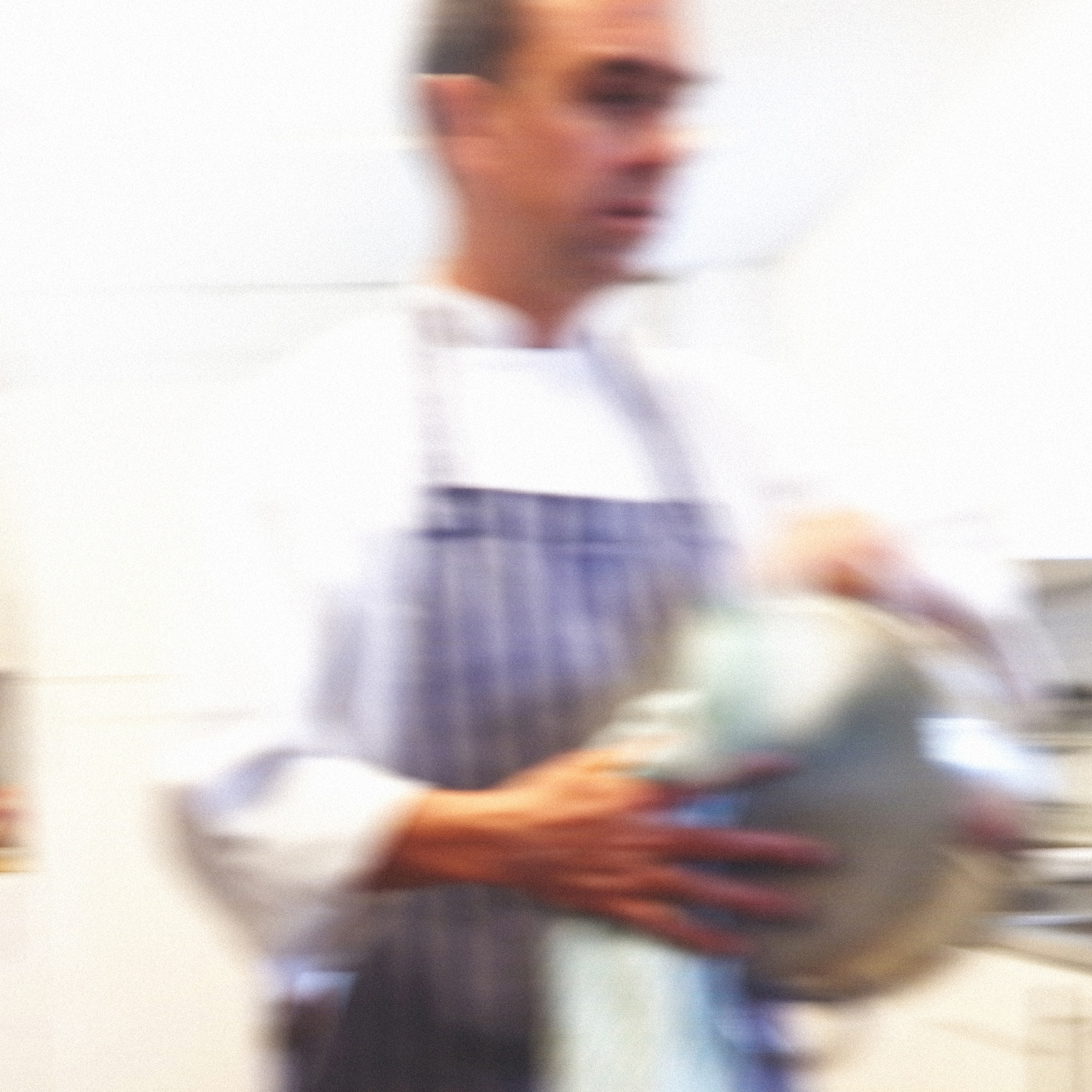 blurred photo of chef at work
